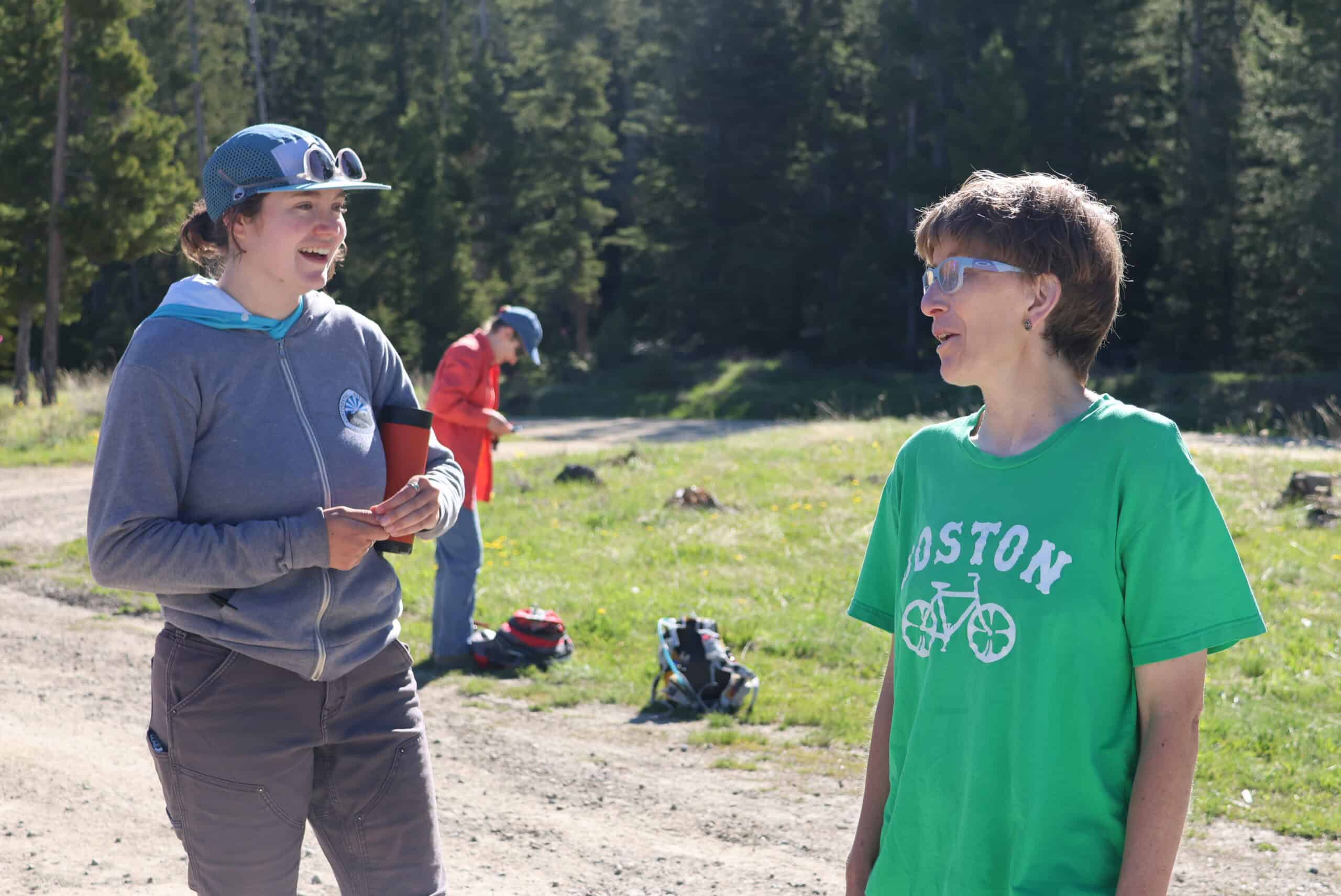 A CDTC field staff member talks with a CDTC member on a field project near Butte, Montana.