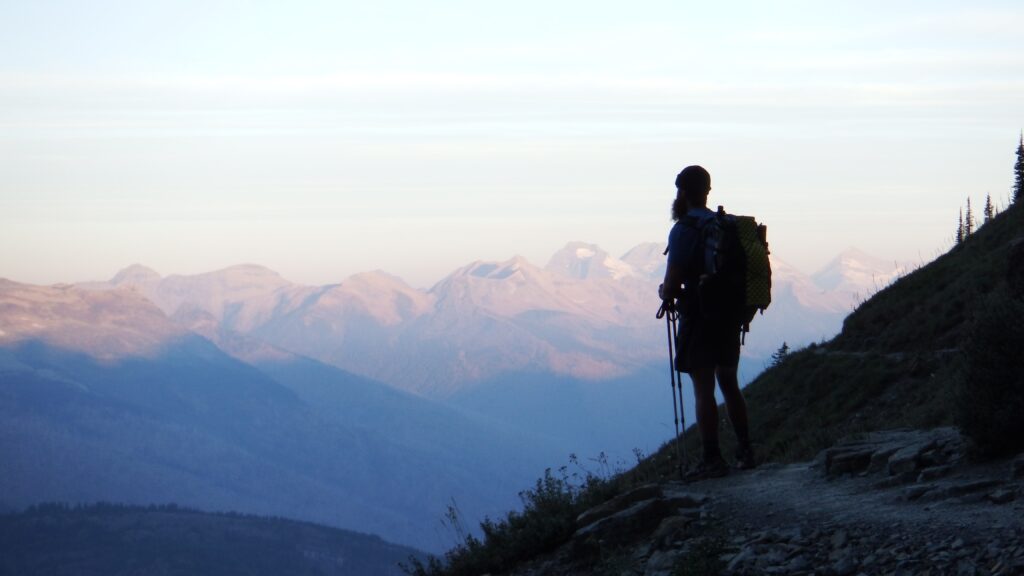 Hiker Montana A hiker admires a mountain view in Montana