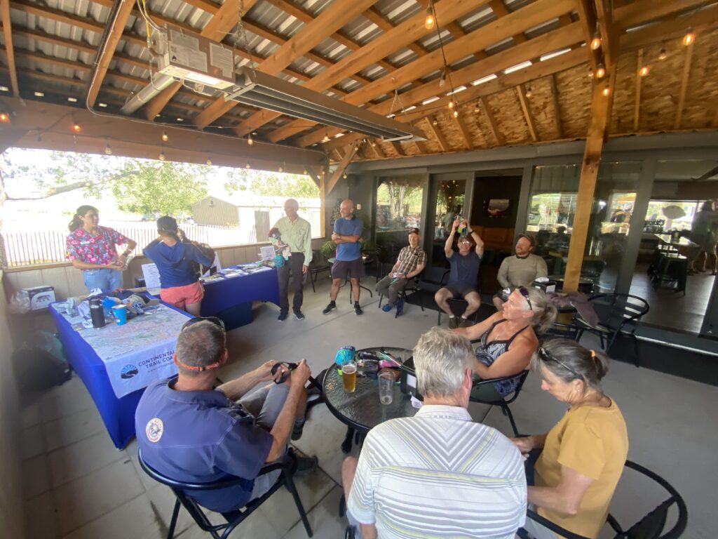 A group of people gathered in a circle winning prizes