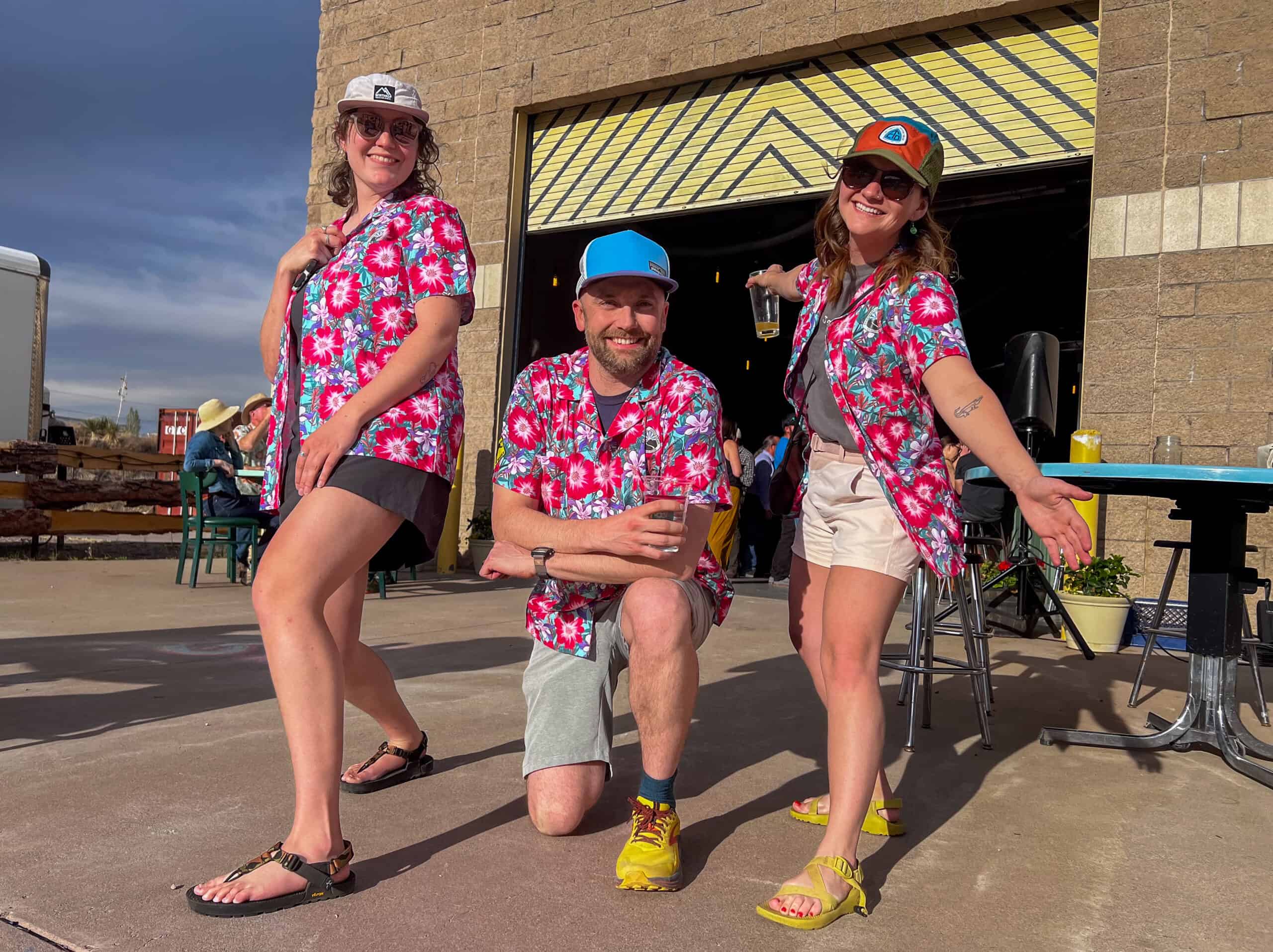 CDTC staffers display pink floral shirts at the 2024 Trail Days. 