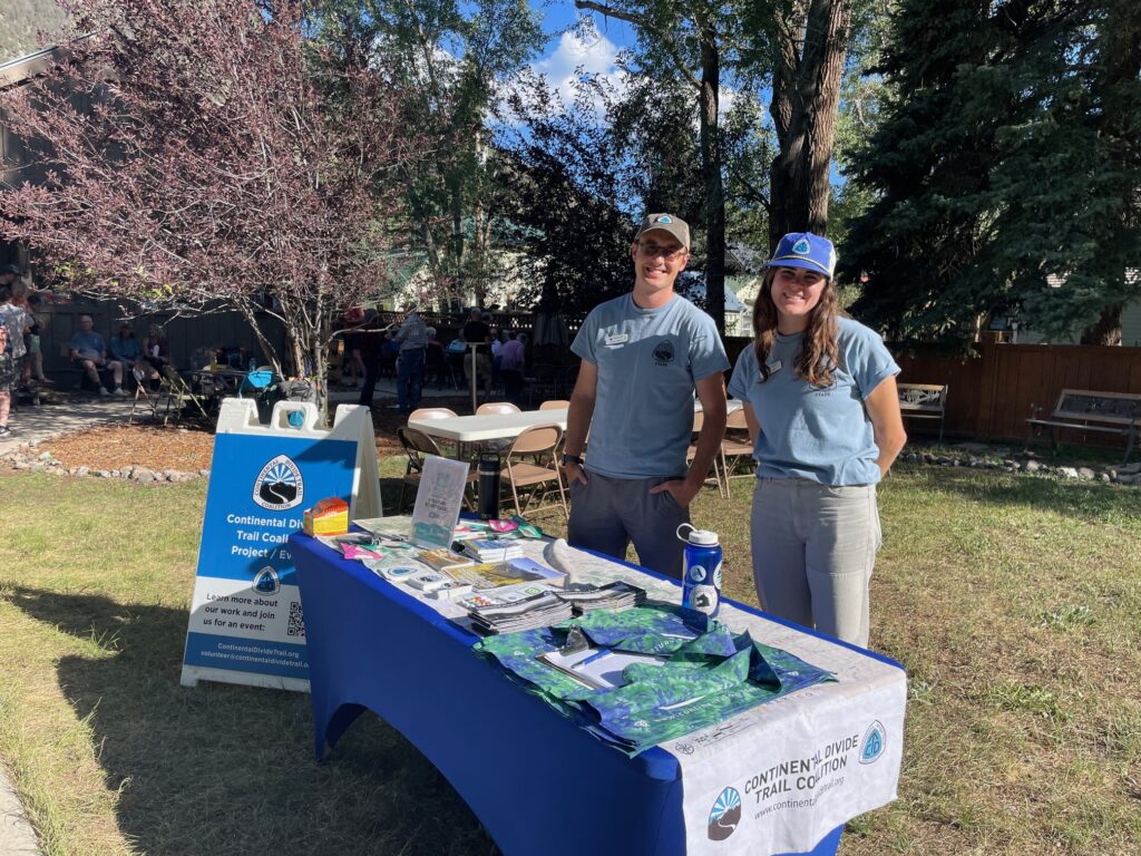 Two people at a Continental Divide Trail outreach table